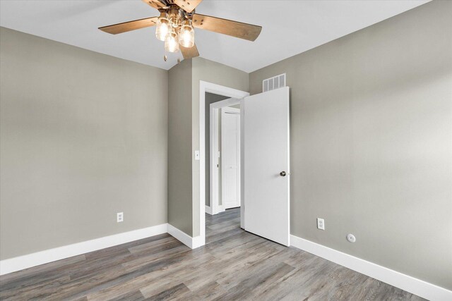 1801 Cindy Lynn St, Urbana, IL 61802 - empty room with ceiling fan, baseboards, and wood finished floors