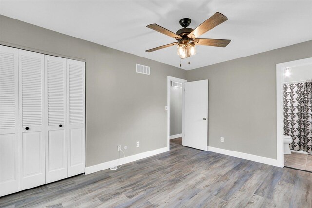 1801 Cindy Lynn St, Urbana, IL 61802 - unfurnished bedroom featuring a closet, wood finished floors, baseboards, and connected bathroom