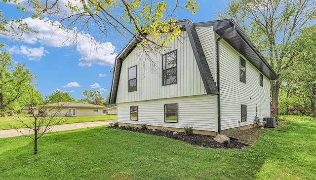1801 Cindy Lynn St, Urbana, IL 61802 - view of home's exterior featuring cooling unit and a lawn