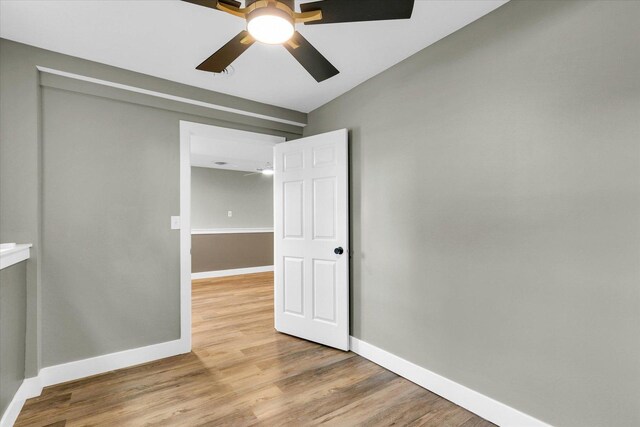 1801 Cindy Lynn St, Urbana, IL 61802 - spare room with a ceiling fan, light wood finished floors, and baseboards