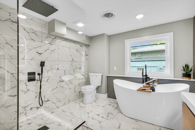1801 Cindy Lynn St, Urbana, IL 61802 - bathroom with a marble finish shower, a freestanding tub, toilet, marble tiled flooring, and recessed lighting