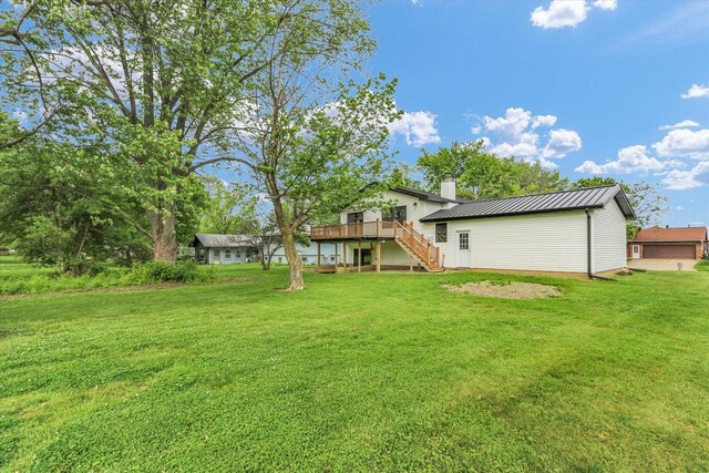 1801 Cindy Lynn St, Urbana, IL 61802 - view of grassy yard with stairway and a wooden deck