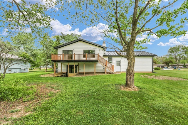 1801 Cindy Lynn St, Urbana, IL 61802 - rear view of house with stairs, a wooden deck, and a lawn