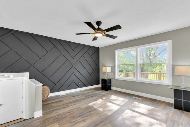 1801 Cindy Lynn St, Urbana, IL 61802 - empty room with baseboards, a ceiling fan, and wood finished floors