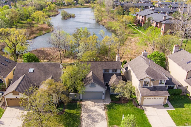 aerial view with a residential view and a water view