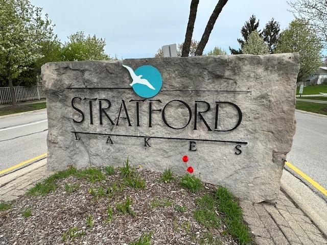 community sign with fence