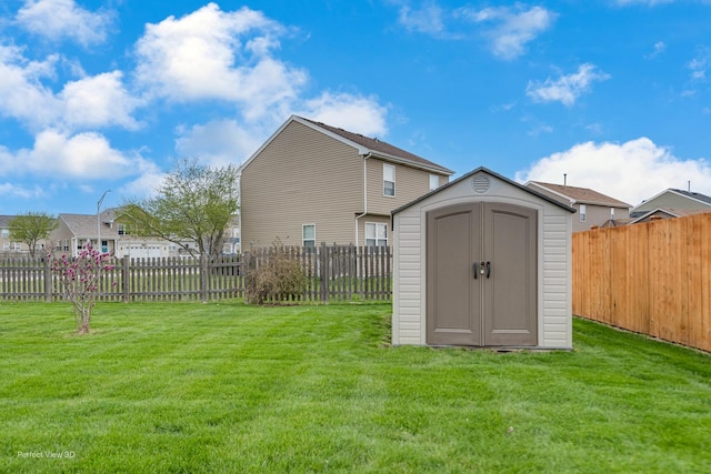 view of shed featuring a fenced backyard