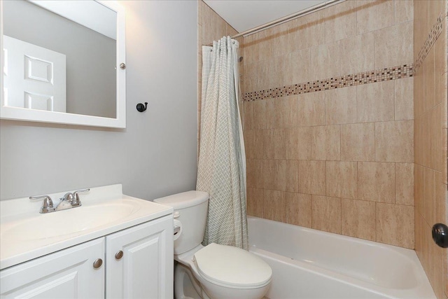 bathroom featuring shower / tub combo with curtain, toilet, and vanity
