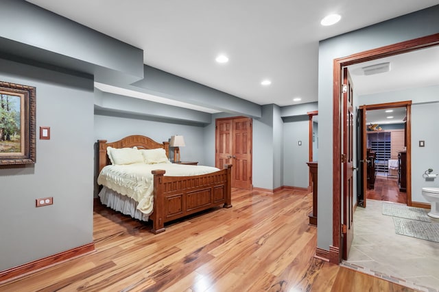 bedroom featuring light wood-type flooring, recessed lighting, and baseboards