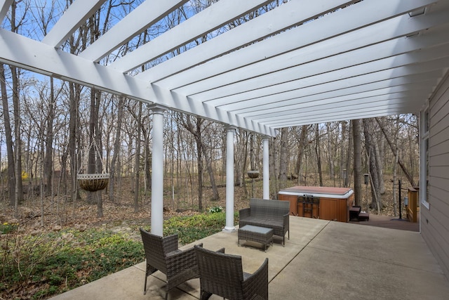 view of patio featuring a hot tub and a pergola