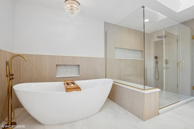 87 Windmill Rd, Orland Park, IL 60467 - full bath with a stall shower, a freestanding tub, a wainscoted wall, tile walls, and a chandelier