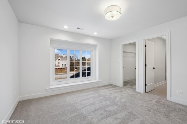 87 Windmill Rd, Orland Park, IL 60467 - unfurnished bedroom with carpet floors, baseboards, a walk in closet, recessed lighting, and a closet