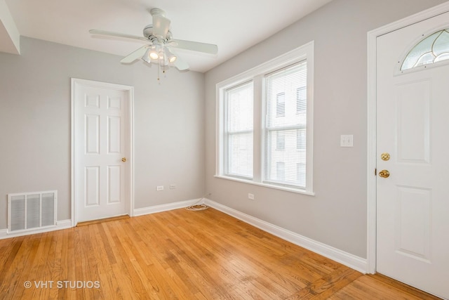 4449 W Sunnyside Ave Unit 2, Chicago, IL 60630 - entryway with light wood-style flooring and ceiling fan