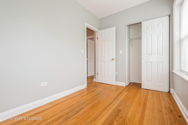 4449 W Sunnyside Ave Unit 2, Chicago, IL 60630 - unfurnished bedroom with light wood-type flooring and a closet