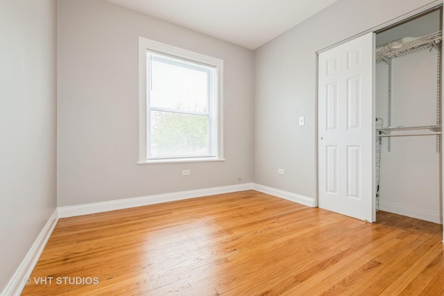 4449 W Sunnyside Ave Unit 2, Chicago, IL 60630 - unfurnished bedroom featuring light wood-type flooring and a closet