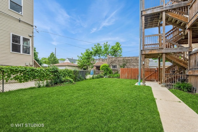 4449 W Sunnyside Ave Unit 2, Chicago, IL 60630 - view of yard featuring stairway and a deck