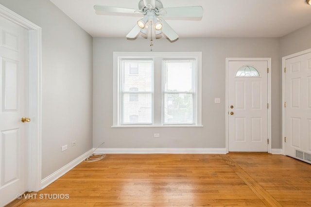 4449 W Sunnyside Ave Unit 2, Chicago, IL 60630 - entrance foyer with light wood-style flooring and a ceiling fan