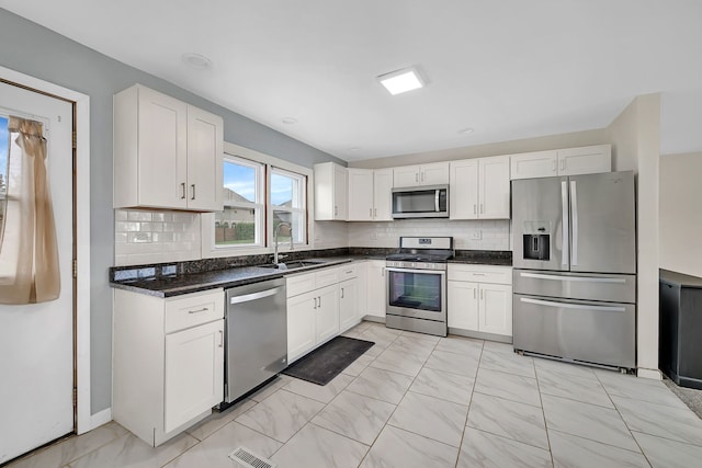 11007 W 167th St, Orland Park, IL 60467 - kitchen featuring a sink, marble finish floor, white cabinetry, and stainless steel appliances