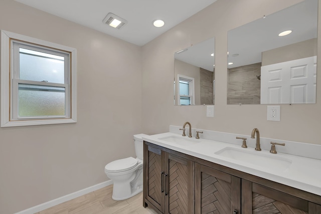 11007 W 167th St, Orland Park, IL 60467 - bathroom featuring visible vents, a sink, baseboards, and a tile shower