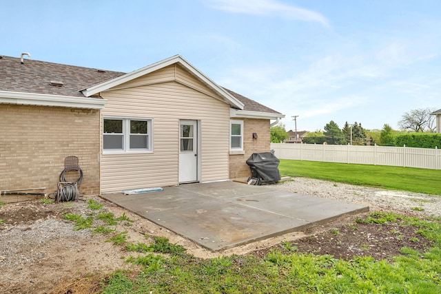 11007 W 167th St, Orland Park, IL 60467 - rear view of house with fence, a patio, roof with shingles, brick siding, and a yard