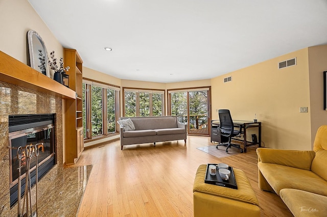 2111 Belleau Woods Ct, Wheaton, IL 60189 - living area featuring a high end fireplace, recessed lighting, light wood finished floors, and visible vents