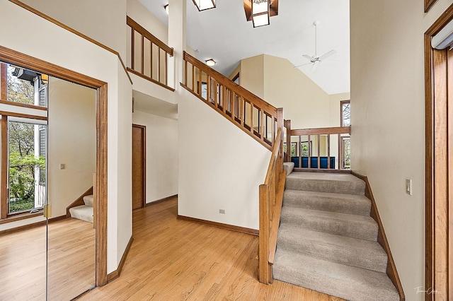 2111 Belleau Woods Ct, Wheaton, IL 60189 - staircase with baseboards, a ceiling fan, high vaulted ceiling, and wood finished floors