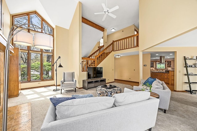 2111 Belleau Woods Ct, Wheaton, IL 60189 - carpeted living room featuring baseboards, ceiling fan, high vaulted ceiling, and stairway