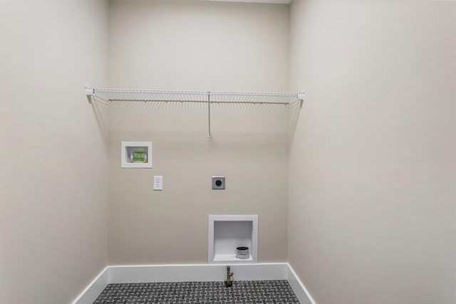 washroom with hookup for an electric dryer, laundry area, baseboards, and hookup for a washing machine