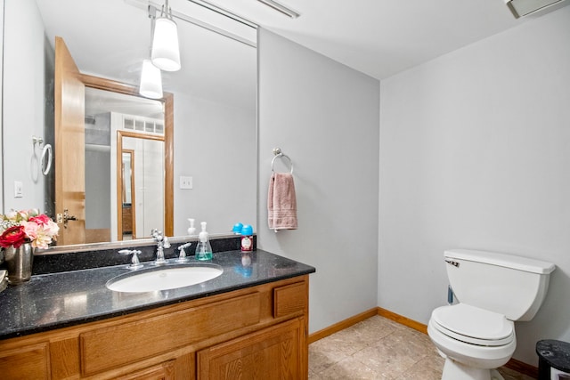 bathroom featuring tile patterned floors, vanity, baseboards, toilet, and visible vents