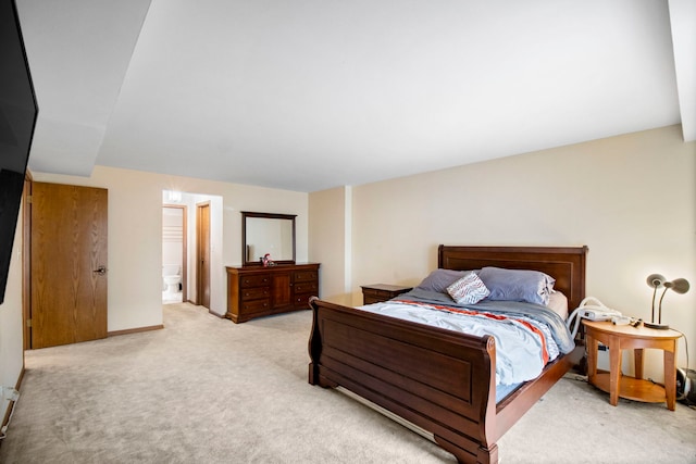 bedroom featuring baseboards and light colored carpet