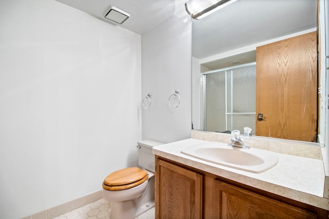 full bath with a stall shower, vanity, toilet, tile patterned flooring, and visible vents