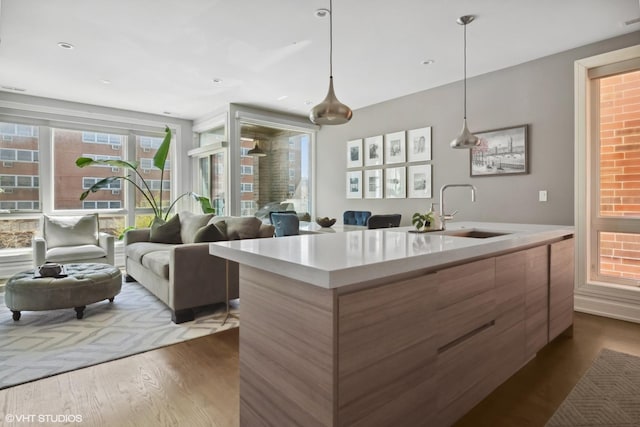 1448 W Chestnut St Unit 2, Chicago, IL 60642 - kitchen with modern cabinets, a sink, light countertops, dark wood-style floors, and an island with sink