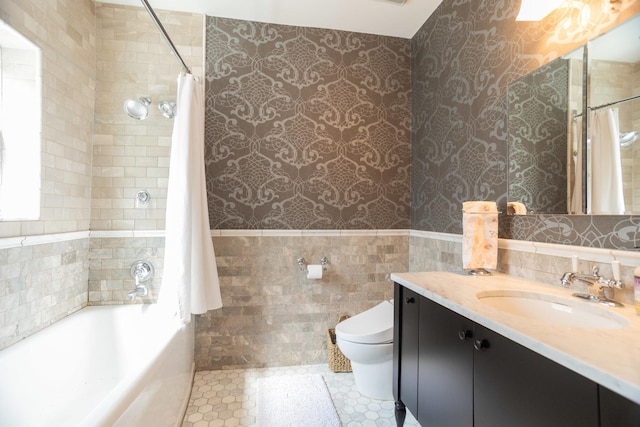 4432 N Racine Ave Unit 3S, Chicago, IL 60640 - full bath featuring tile walls, wallpapered walls, toilet, wainscoting, and vanity