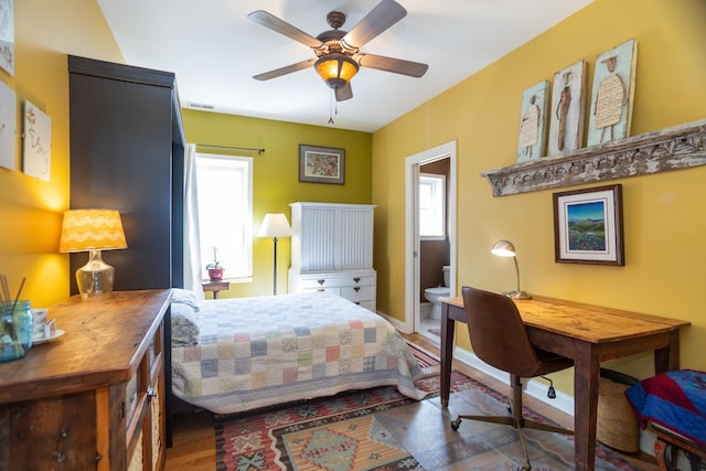 4432 N Racine Ave Unit 3S, Chicago, IL 60640 - bedroom featuring multiple windows, wood finished floors, visible vents, and baseboards