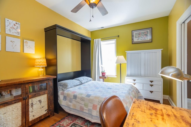 4432 N Racine Ave Unit 3S, Chicago, IL 60640 - bedroom with a ceiling fan, visible vents, and wood finished floors