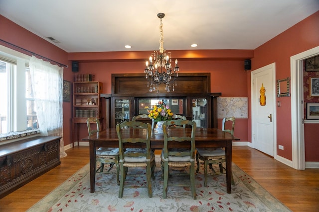 4432 N Racine Ave Unit 3S, Chicago, IL 60640 - dining area featuring recessed lighting, baseboards, visible vents, a chandelier, and wood finished floors