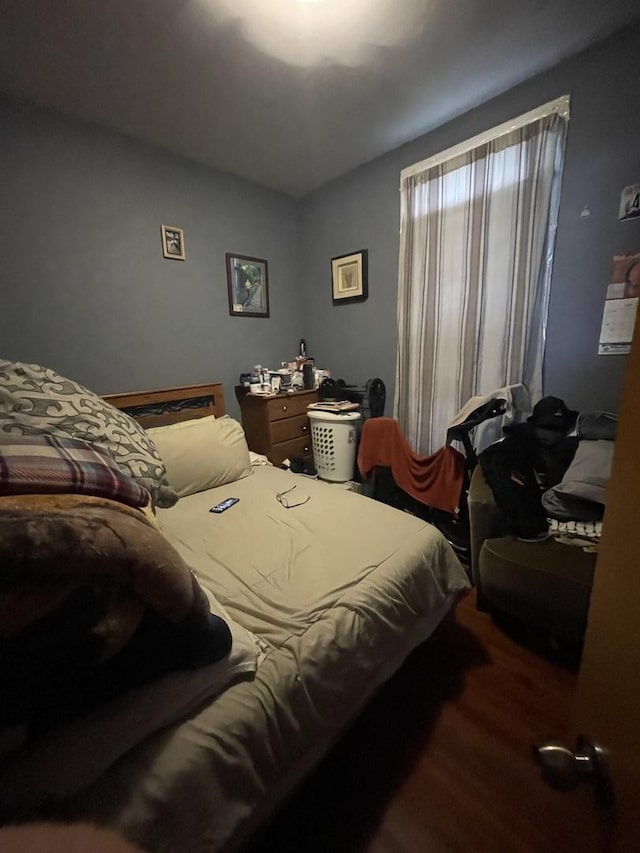 bedroom with wood finished floors