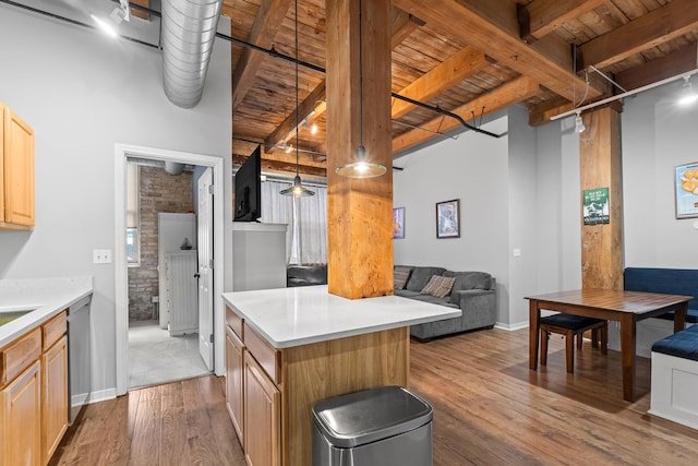 1740 N Maplewood Ave Unit 102, Chicago, IL 60647 - kitchen with light brown cabinetry, wood finished floors, stainless steel dishwasher, beamed ceiling, and wood ceiling