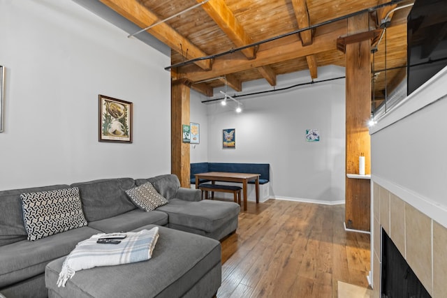 1740 N Maplewood Ave Unit 102, Chicago, IL 60647 - living room with wood-type flooring, a fireplace, wooden ceiling, and beamed ceiling