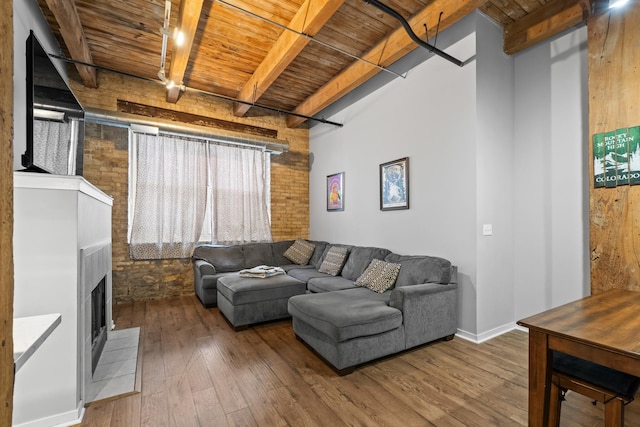 1740 N Maplewood Ave Unit 102, Chicago, IL 60647 - living area featuring wood-type flooring, a fireplace, wooden ceiling, and beamed ceiling