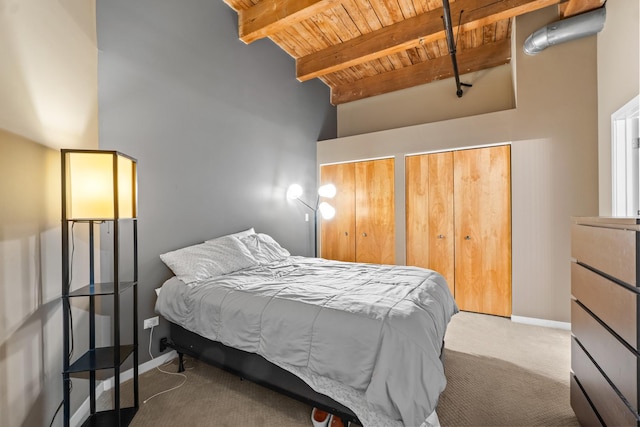 1740 N Maplewood Ave Unit 102, Chicago, IL 60647 - bedroom with a towering ceiling, carpet floors, beam ceiling, wood ceiling, and two closets