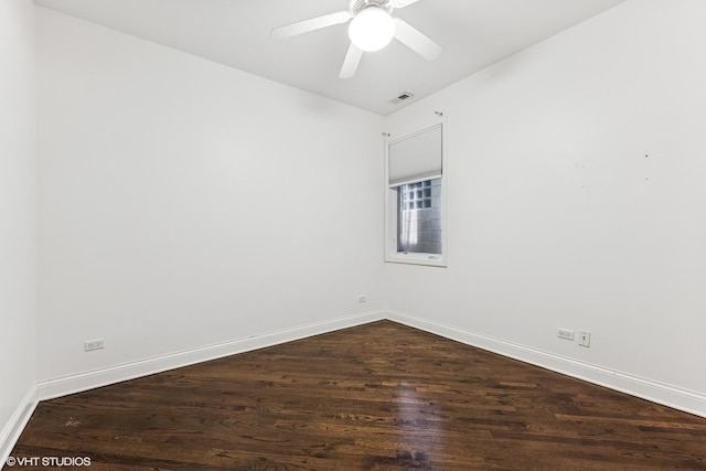 2259 W Wabansia Ave Unit 309, Chicago, IL 60647 - spare room featuring dark wood-style floors, baseboards, and ceiling fan