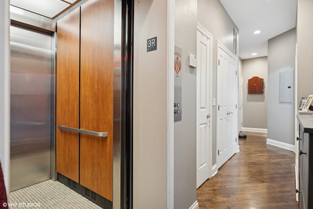 2259 W Wabansia Ave Unit 309, Chicago, IL 60647 - hallway with elevator, recessed lighting, baseboards, dark wood-style floors, and electric panel