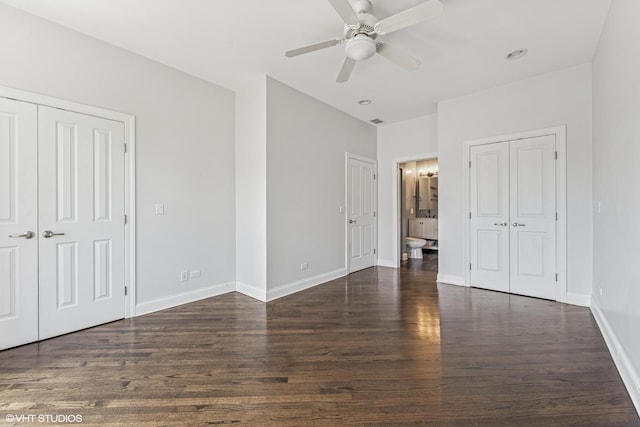2259 W Wabansia Ave Unit 309, Chicago, IL 60647 - unfurnished bedroom with wood finished floors, baseboards, multiple closets, connected bathroom, and ceiling fan