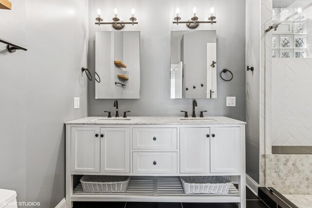 2259 W Wabansia Ave Unit 309, Chicago, IL 60647 - full bath with double vanity, tiled shower, toilet, and baseboards
