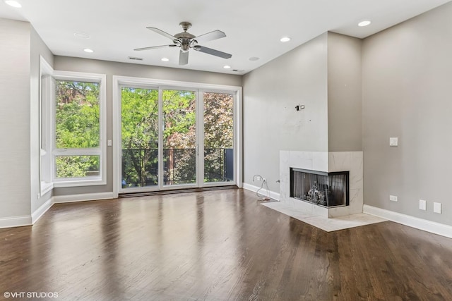 2259 W Wabansia Ave Unit 309, Chicago, IL 60647 - unfurnished living room featuring baseboards, a ceiling fan, wood finished floors, a tile fireplace, and recessed lighting