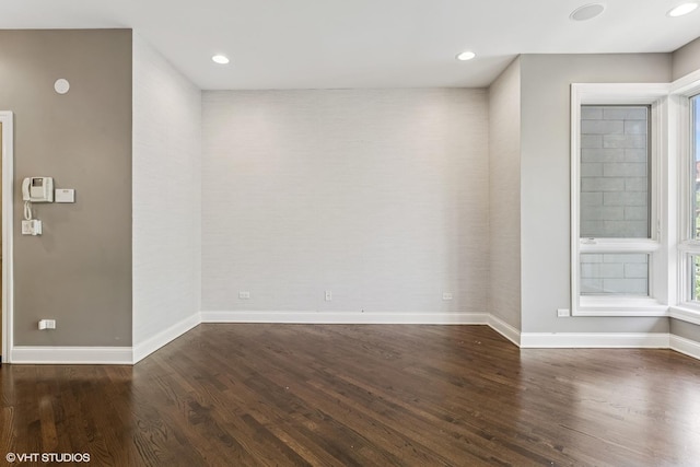 2259 W Wabansia Ave Unit 309, Chicago, IL 60647 - unfurnished room with baseboards, wood finished floors, healthy amount of natural light, and recessed lighting
