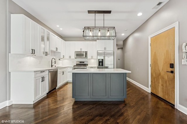 2259 W Wabansia Ave Unit 309, Chicago, IL 60647 - kitchen featuring stainless steel appliances, a sink, decorative backsplash, light countertops, and recessed lighting