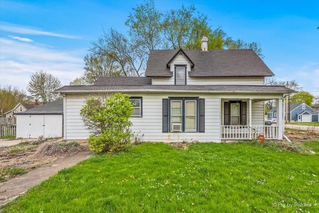 view of front of property with a chimney, covered porch, a shingled roof, and a front lawn