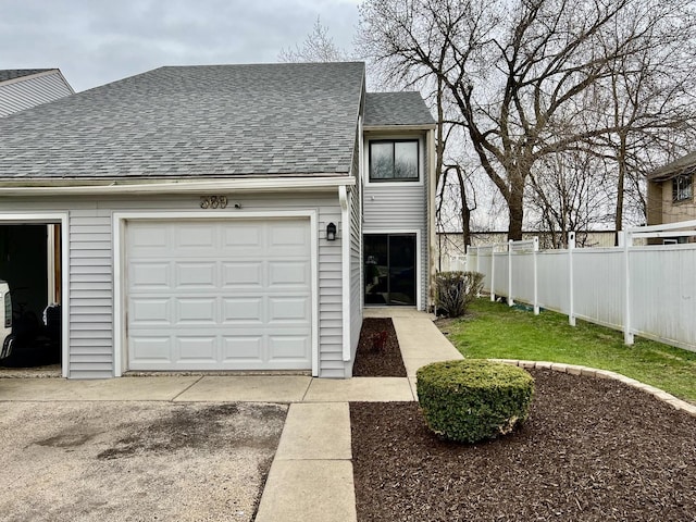 exterior space with driveway and fence